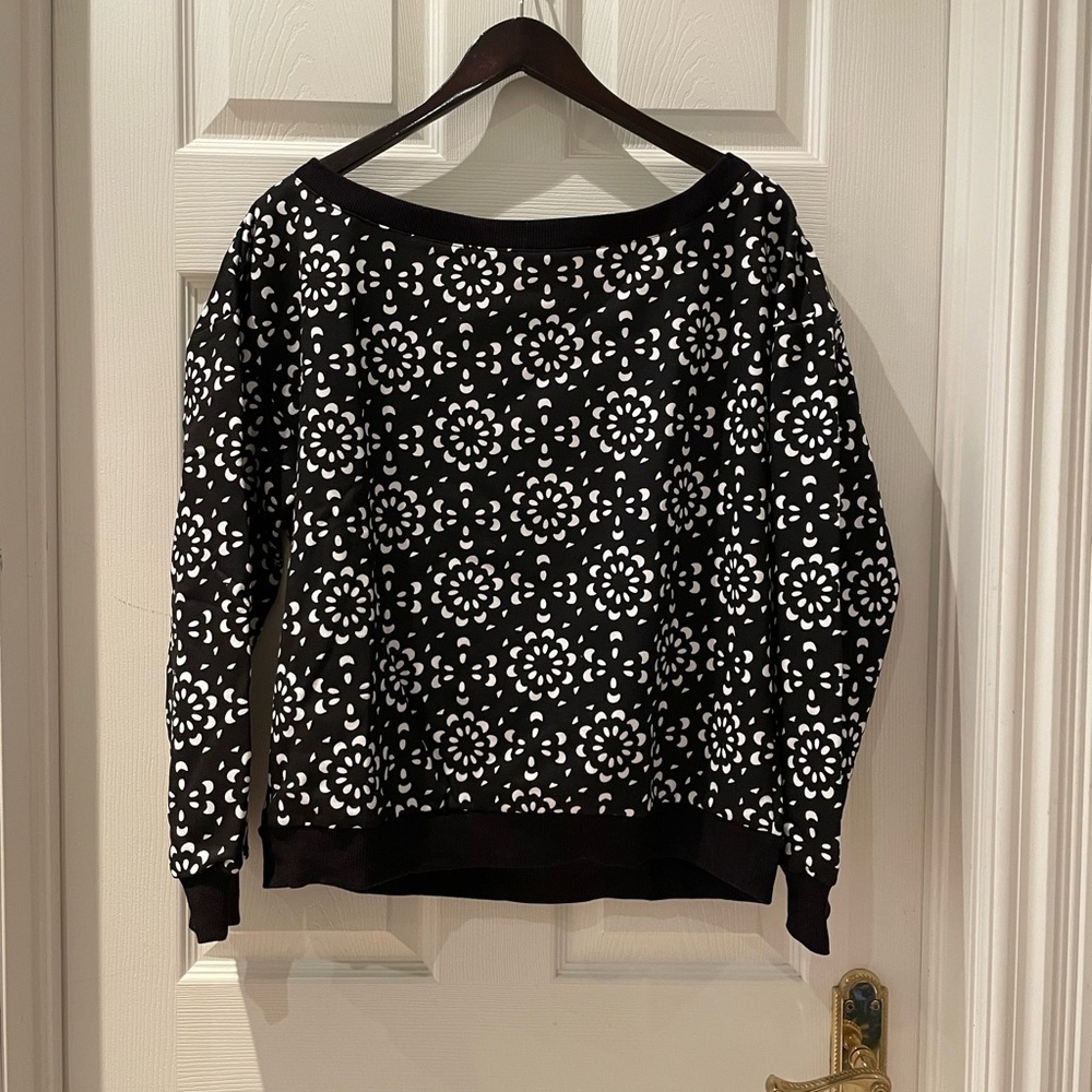 Woman’s patterned sweater
